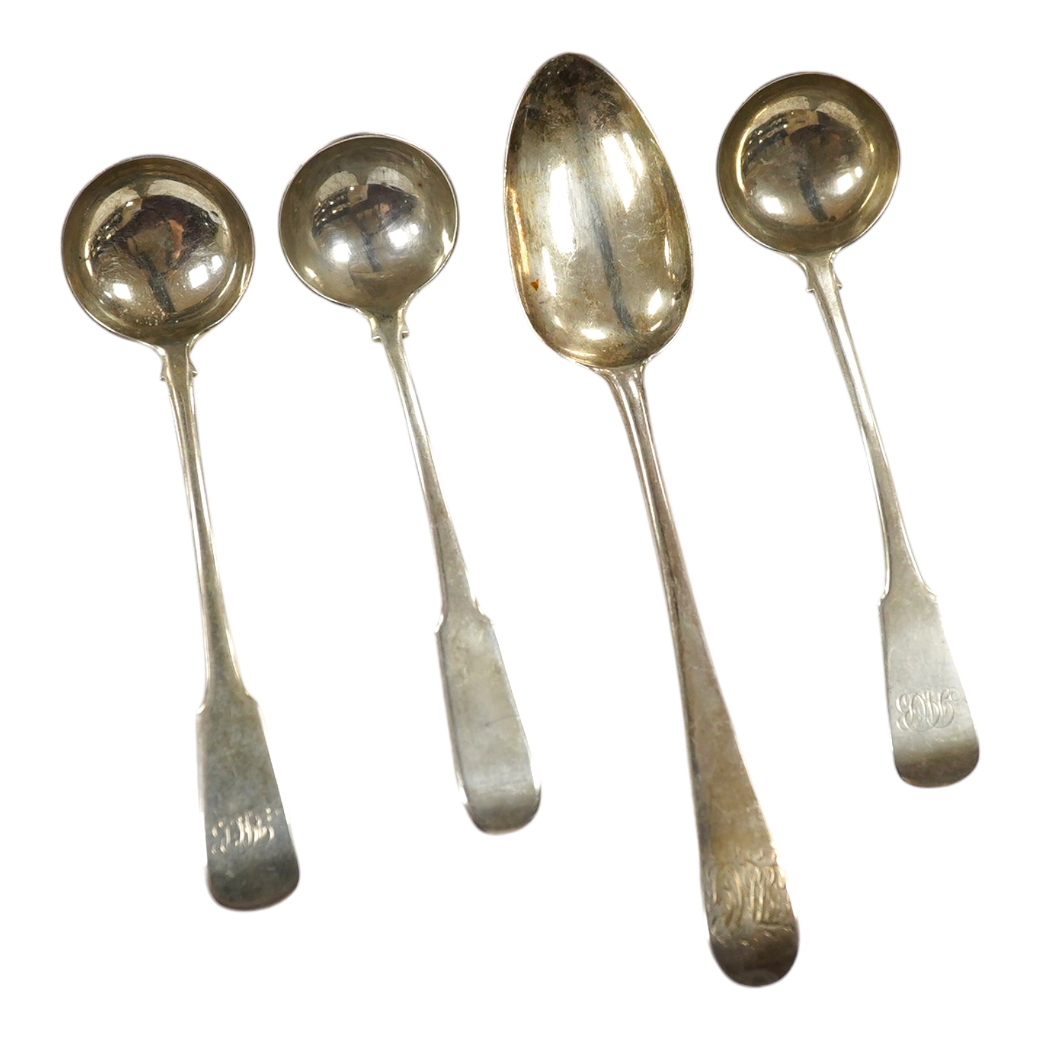 A George III silver table spoon by Hester Bateman, London, 1784, 21.5cm, together with three 19th century Scottish provincial silver toddy ladles by David Gray, Dumfries. Condition - fair